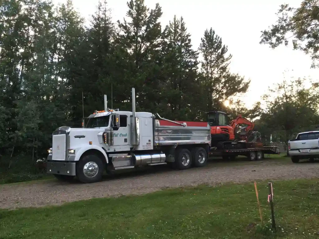 Heavy equipment hauling? At Rat Creek Construction, we do provide heavy equipment services, hauling and towing across the entire Yellowhead County and Western Canada